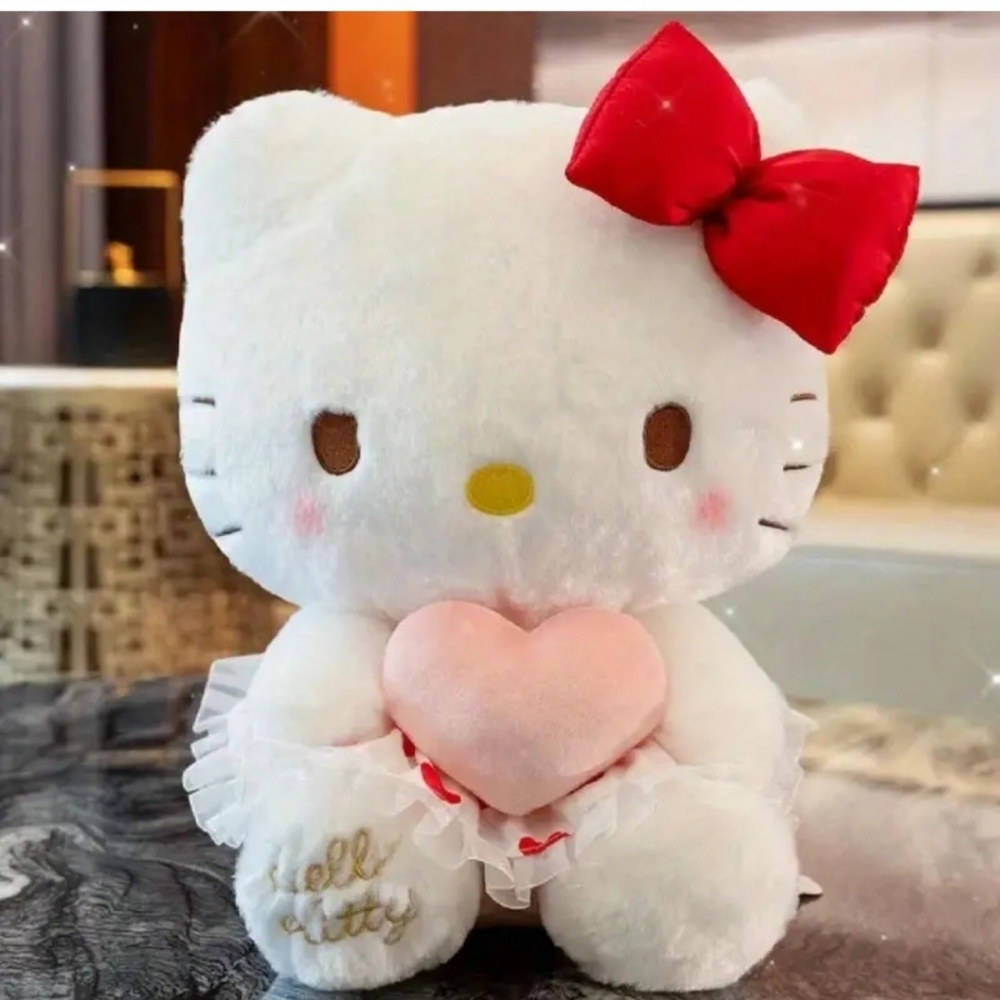 Hello Kitty Sanrio character plush doll with pink heart.